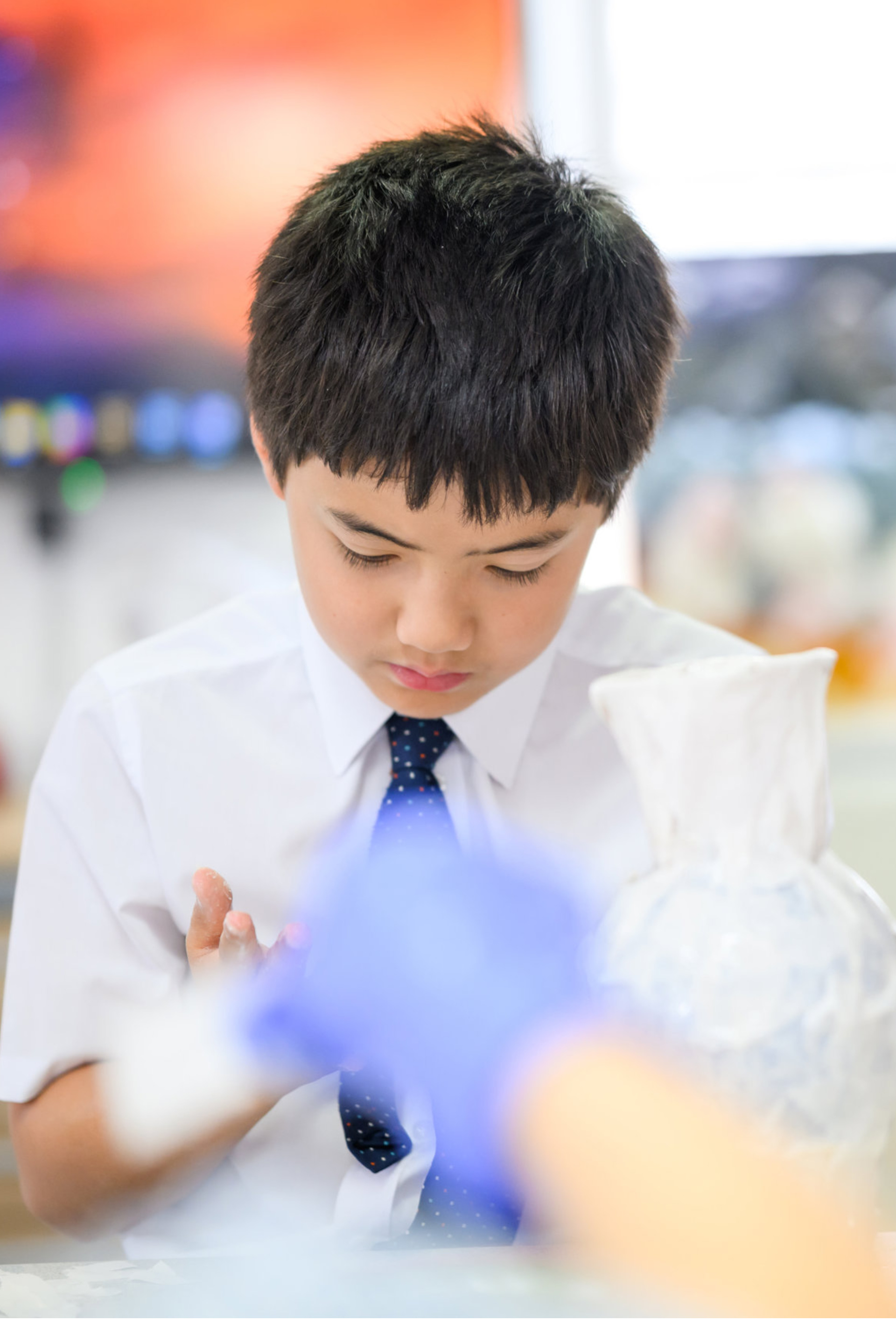 Student concentrating on classroom project